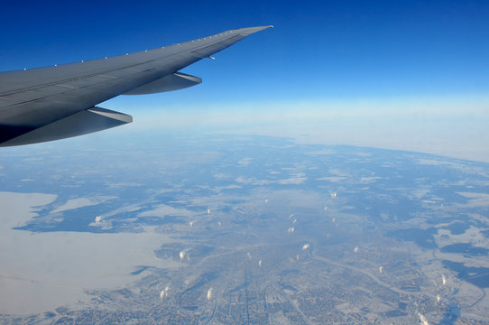 In flight picture from the window of a Boeing 777 over the city of  Saint Petersburg