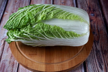 Fresh peking cabbage on a chopping Board