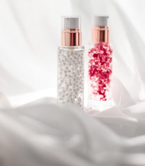 Skincare serum and make-up primer gel bottle, moisturizing lotion and lifting cream emulsion,...