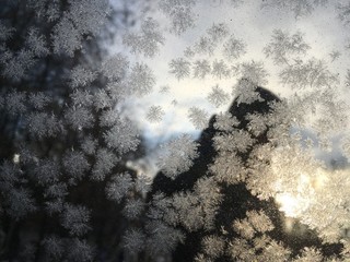 Snowflakes on glass close up macro abstract texture background