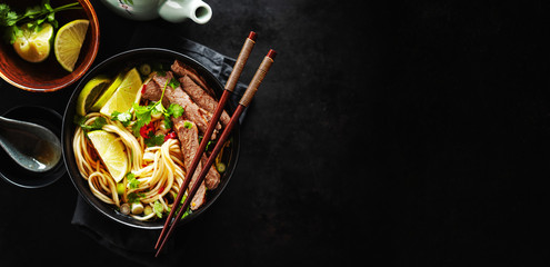 Tasty asian classic soup with noodles and meat