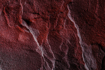 A natural background made of multi-colored wild stone close-up. View from above