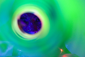 Young woman portrait with fluorescence make up an uv light