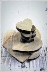 several wooden hearts on a wooden table