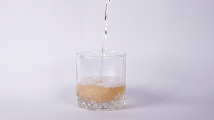 Glass with lemonade on a white background
