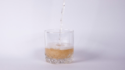 Glass with lemonade on a white background
