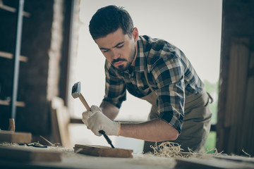 Portrait of his he nice attractive concentrated experienced professional guy specialist designer creating project start-up new modern home house things order at modern industrial loft style interior