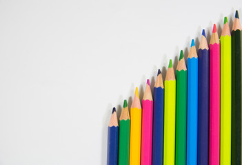 Color pencils in shape of progress bar mountain shape on white background diagonal shape