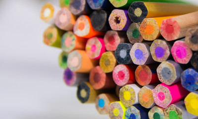 macro focus shot of Bottom side of wooden color pencils creating colorful abstract background