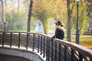stylish woman in autumn park