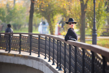 stylish woman in autumn park