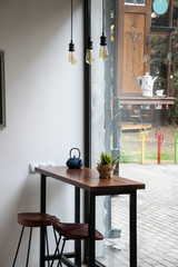 table and chairs front window modern style