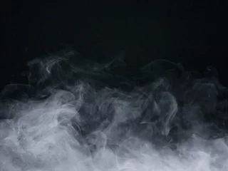 Foto op Canvas rook op zwarte achtergrond © Choukun kub