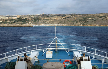 Moving away from the Mgarr Harbour, main port of the Gozo island, Malta