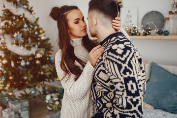 young and pretty couple sitting in a decoration room