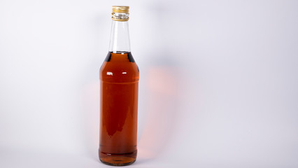 Bottle with cognac, whiskey on a white background