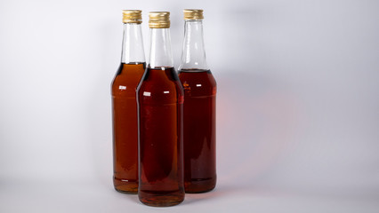 Bottles with cognac, whiskey on a white background