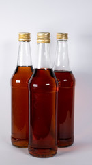 Bottles with cognac, whiskey on a white background