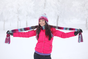 Fototapeta na wymiar Happy girl in winter park