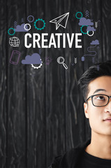 cropped view of asian man in glasses looking at illustration with creative lettering