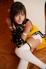 Beautiful anime doll girl in pink dress on yellow. Fabulous look of woman anime heroine