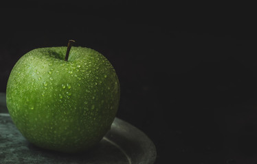 Fresh granny smith apple. Vertical image. Food concept