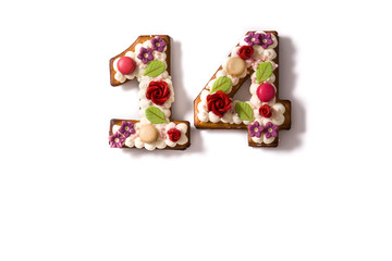 Valentine's Day cake with 14 number with flowers decorated isolated on white background. Copy space	