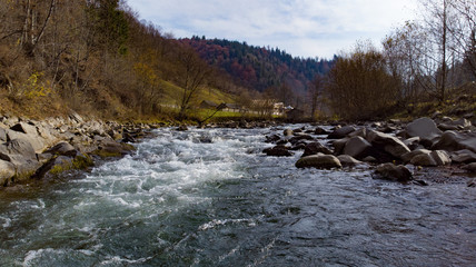 Shooting of the fast flowing water of a mountain river.