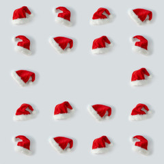 Creative Santa Claus hat pattern with bright background. Minimal winter flat lay Christmas concept.