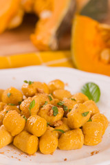 Pumpkin gnocchi with grated amaretti cookies.	