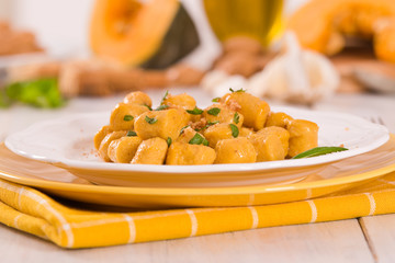 Pumpkin gnocchi with grated amaretti cookies.	