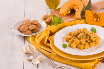 Pumpkin gnocchi with grated amaretti cookies.	