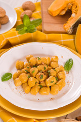 Pumpkin gnocchi with grated amaretti cookies.	