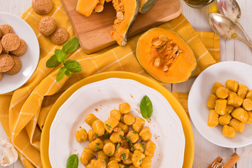 Pumpkin gnocchi with grated amaretti cookies.	