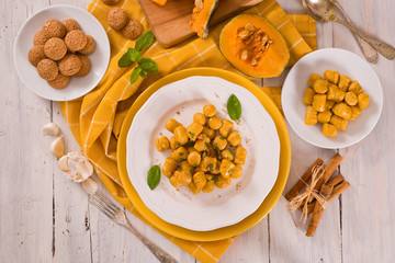Pumpkin gnocchi with grated amaretti cookies.	