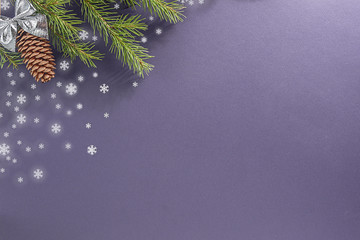 Lilac background for a letter to Santa Claus. Background for a Christmas card. Decorated with fir cones, fir branches, snowflakes, Christmas toys.