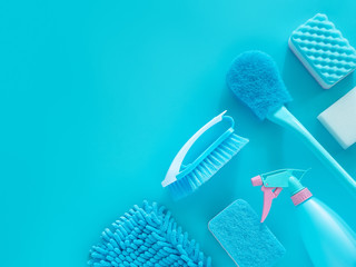 cleaning tools product supplies layout isolated on blue with copy space for template