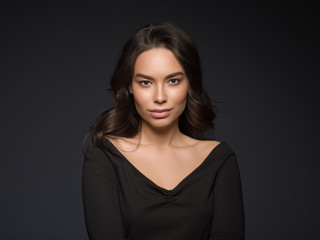 Fototapeta premium Beautiful asian woman black dress curly hair healthy skin natural makeup