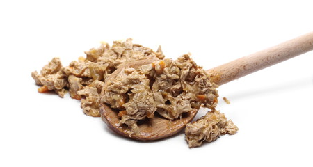 Cat food with wooden spoon, isolated on white background
