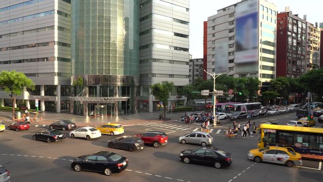 Aerial footage of the intersection with heavy traffic in the middle of Taipei 4k