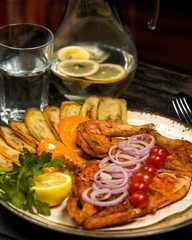 grilled chicken served with aubergine, lemon, parsley and