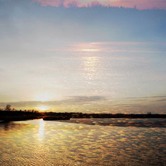 The mixed image of the view of the ice on the surface of the lake and the natural background of the view of the lake shore at the cold spring day at the City Park. 