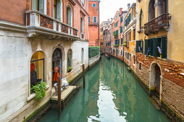 Fototapeta na wymiar Canals of Venice city with traditional colorful architecture, Italy