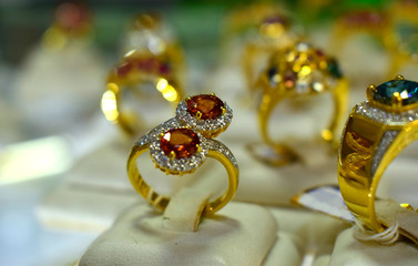 Gold ring set with yellow stones and diamonds In the closet
