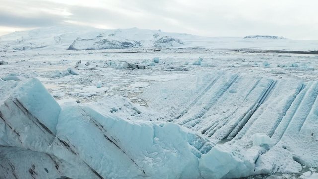 Aerial view of the J kuls rl n glacial lagoon and floating icebergs. The beginning of spring in Iceland