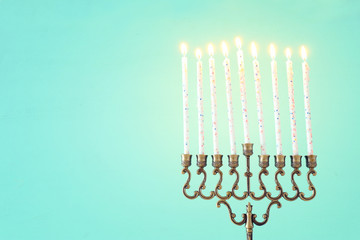 Religion image of jewish holiday Hanukkah background with menorah (traditional candelabra) and candles