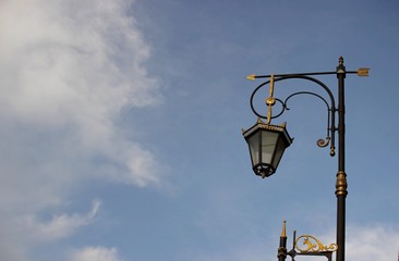 Old beautiful lantern on the bridge. An antique street lamp in the old city. Scape for text.