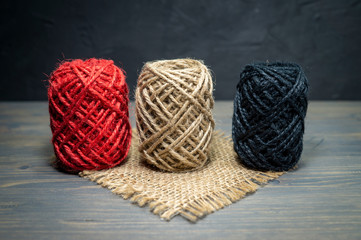 Three balls of natural hemp or sisal twine