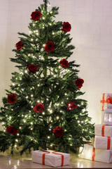 Decorated Christmas room with beautiful fir tree and gift