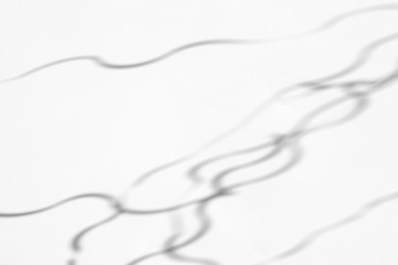 Organic drop diagonal shadow on a white wall, overlay effect for photo and mockups